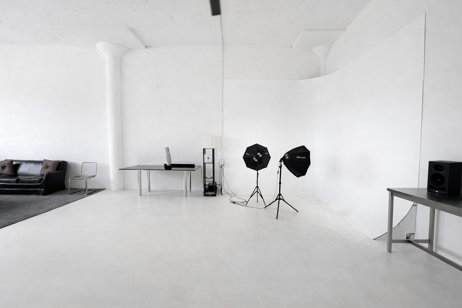 Wide view of Axcer Studio with lighting equipment set up
