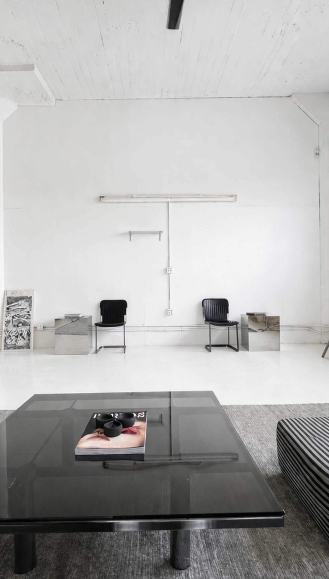 Sunlight casting window shadows across studio walls